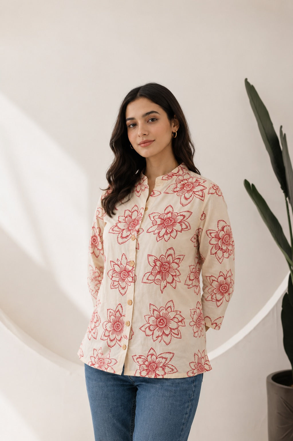 Woman wearing cream floral printed ethnic top with mandarin collar