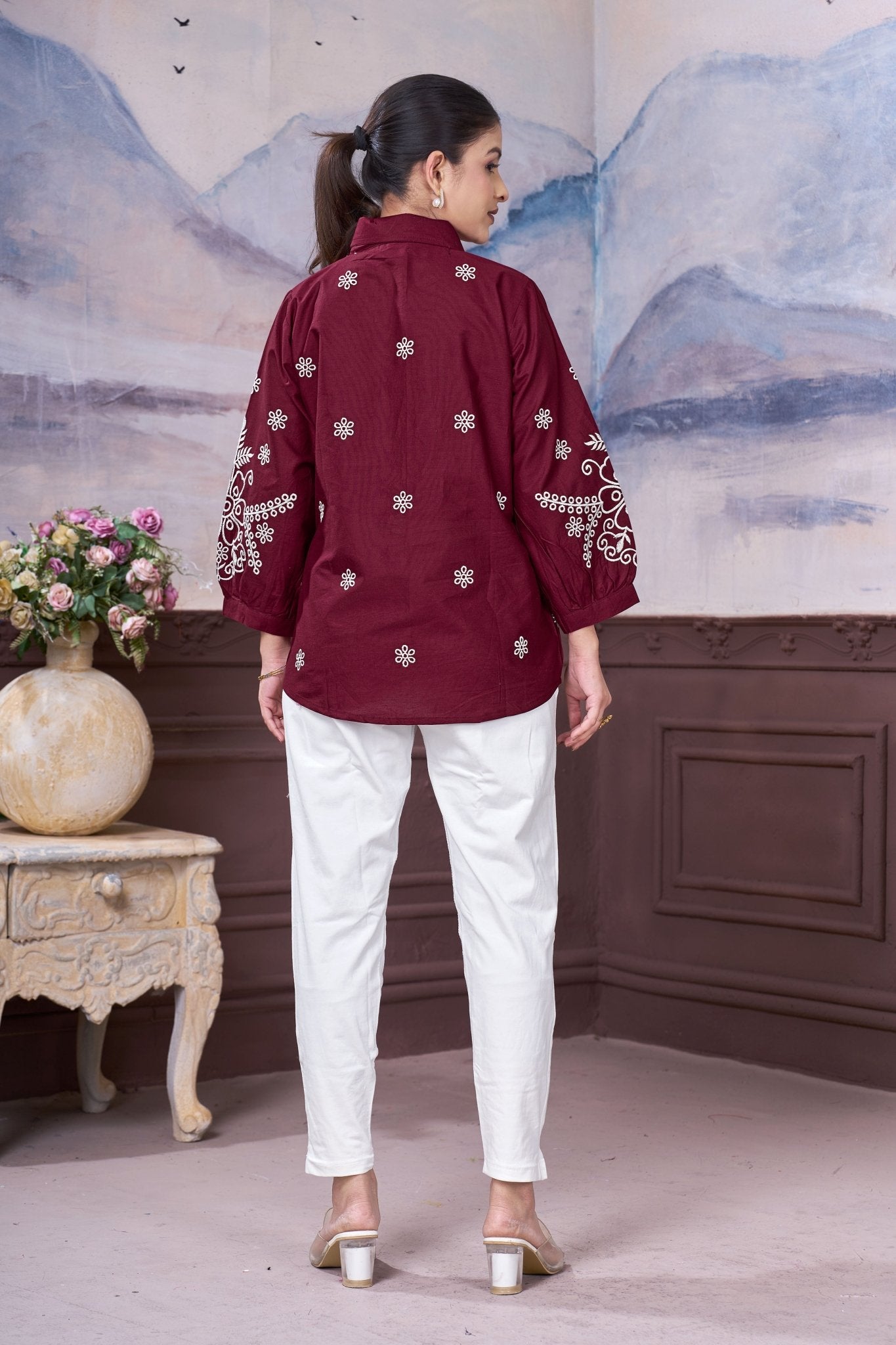Back view of maroon embroidered cotton top for women showing floral embroidery design